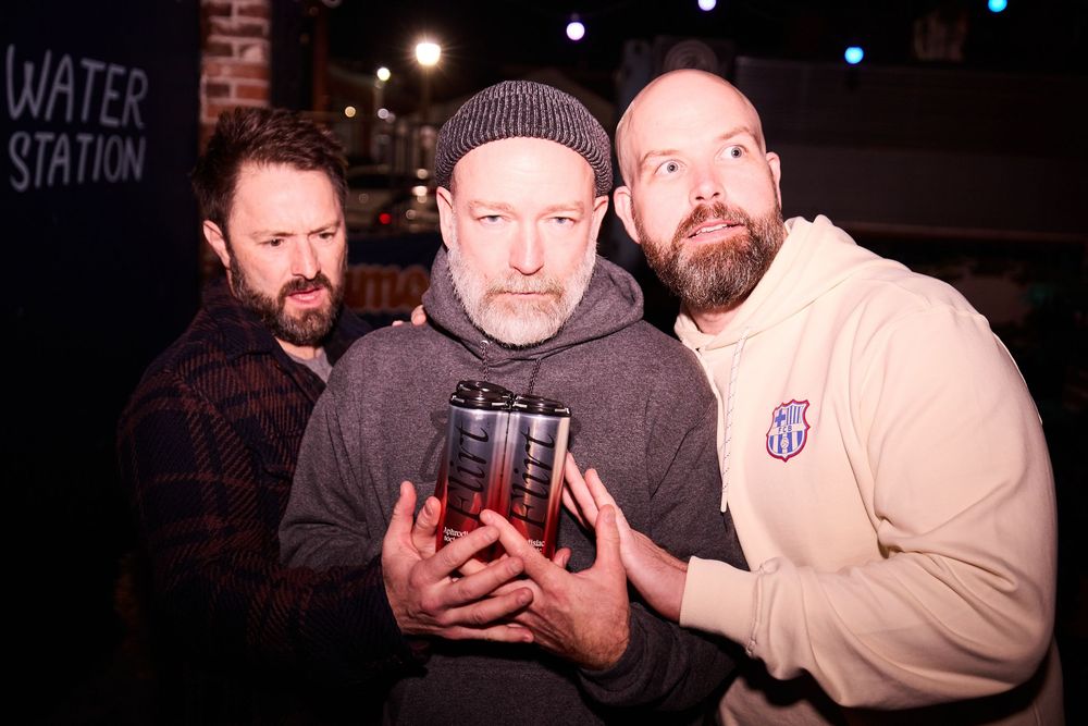 Comedian Kyle Kinane, Daniel Van Kirk, Adam Cayton-Holland back stage for Flyover Comedy Fest