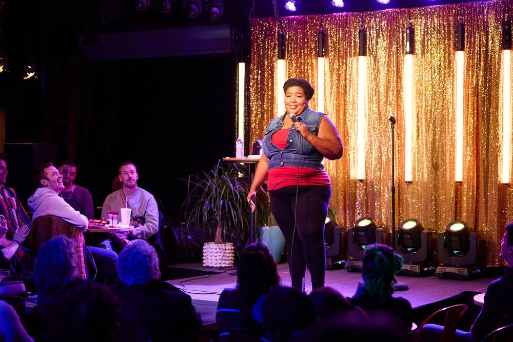 Comedian Dulcé Sloan on stage for Flyover Comedy Fest