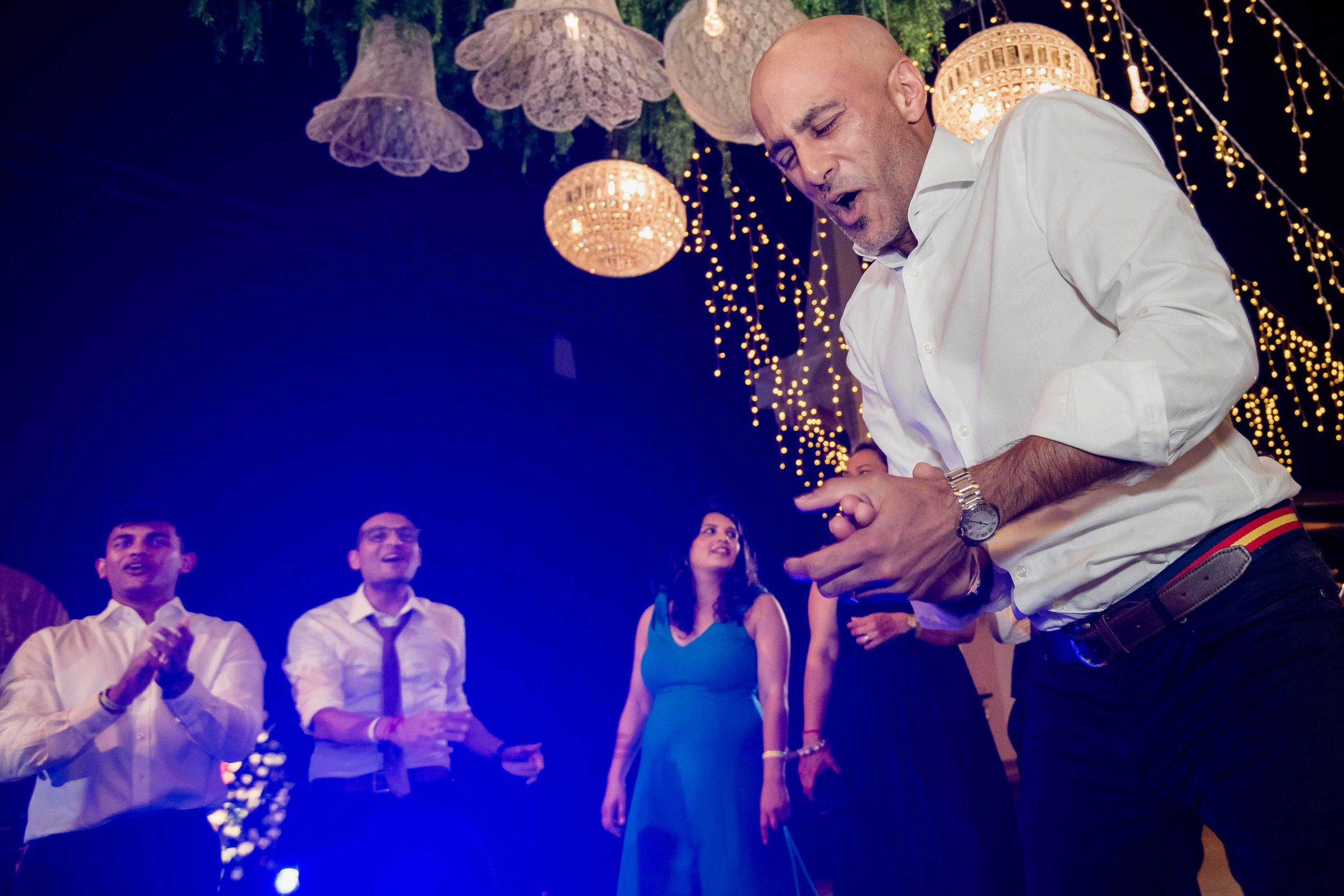 Professional dancers perform an elegant samba dance routine at a glittering ballroom competition.