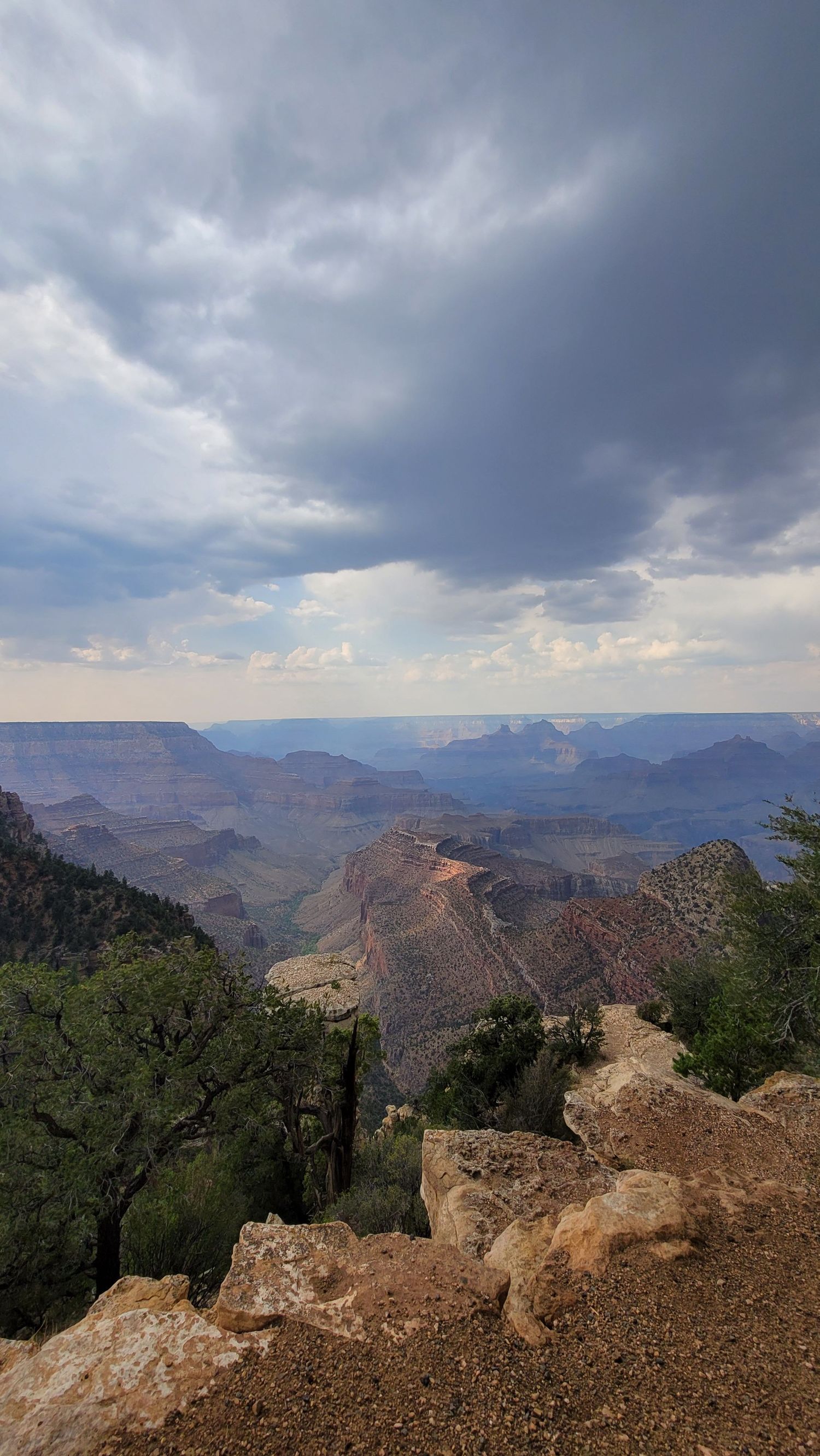 Grand Canyon view with dramatic storm clouds and layered rock formations