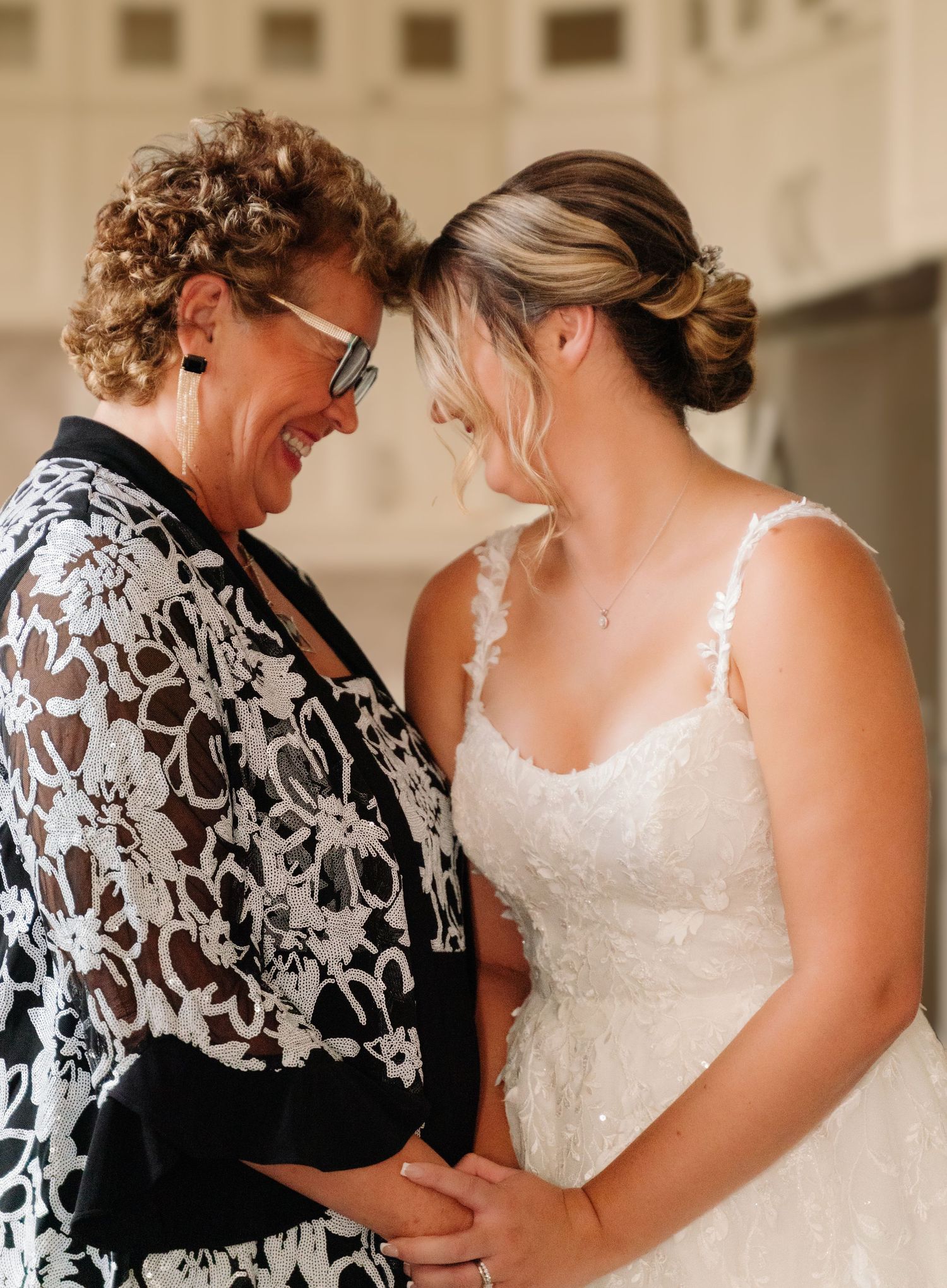 A heartwarming moment shared between two people during wedding preparations.