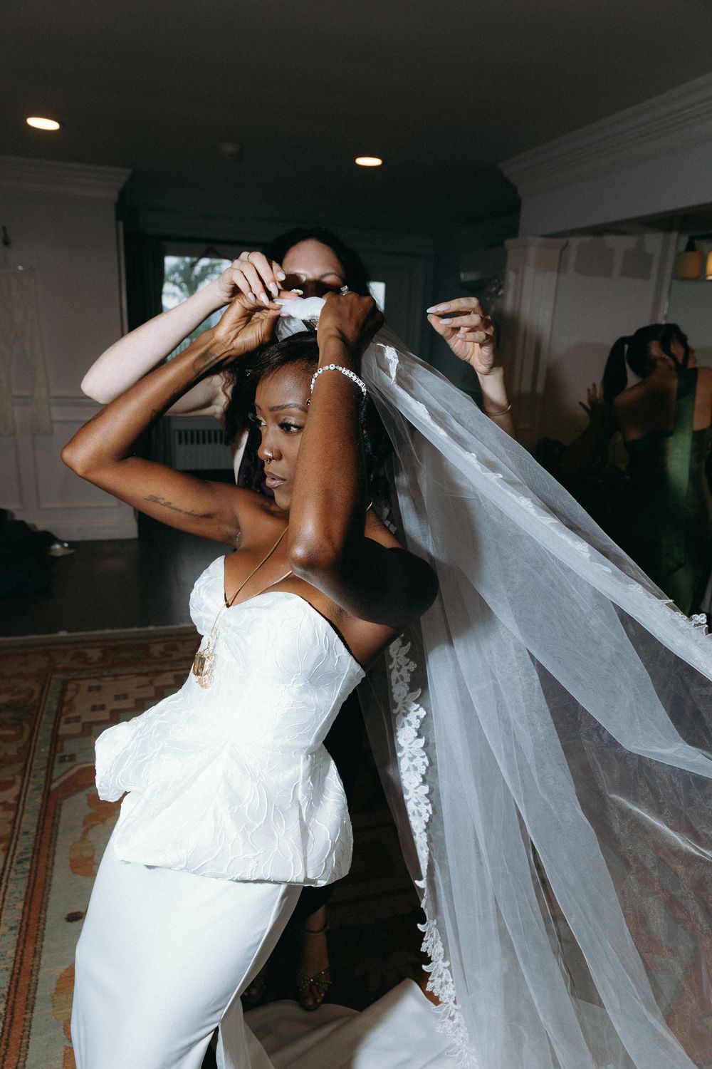 A sequence of photos showing a bride in a white wedding dress and veil dancing at her reception celebration.
