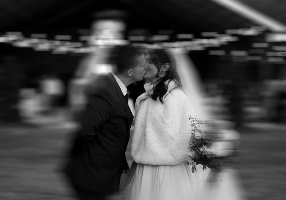Black and white motion blur wedding portrait with romantic atmosphere.