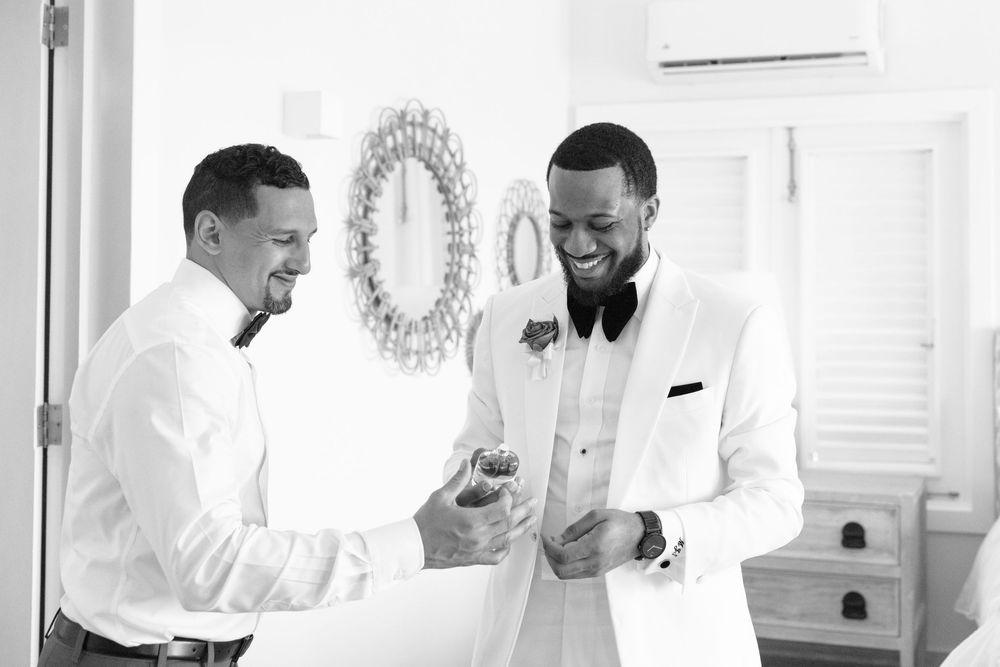 Black and white photo series showing people in white shirts laughing and having fun in a casual setting.