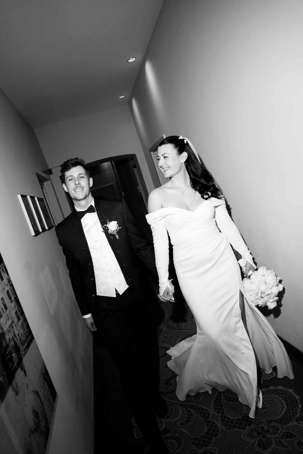 Black and white sequence of a couple dancing in formal wear.