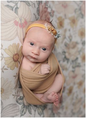 Studio baby portrait with neutral tones and soft lighting in North Austin photography studio