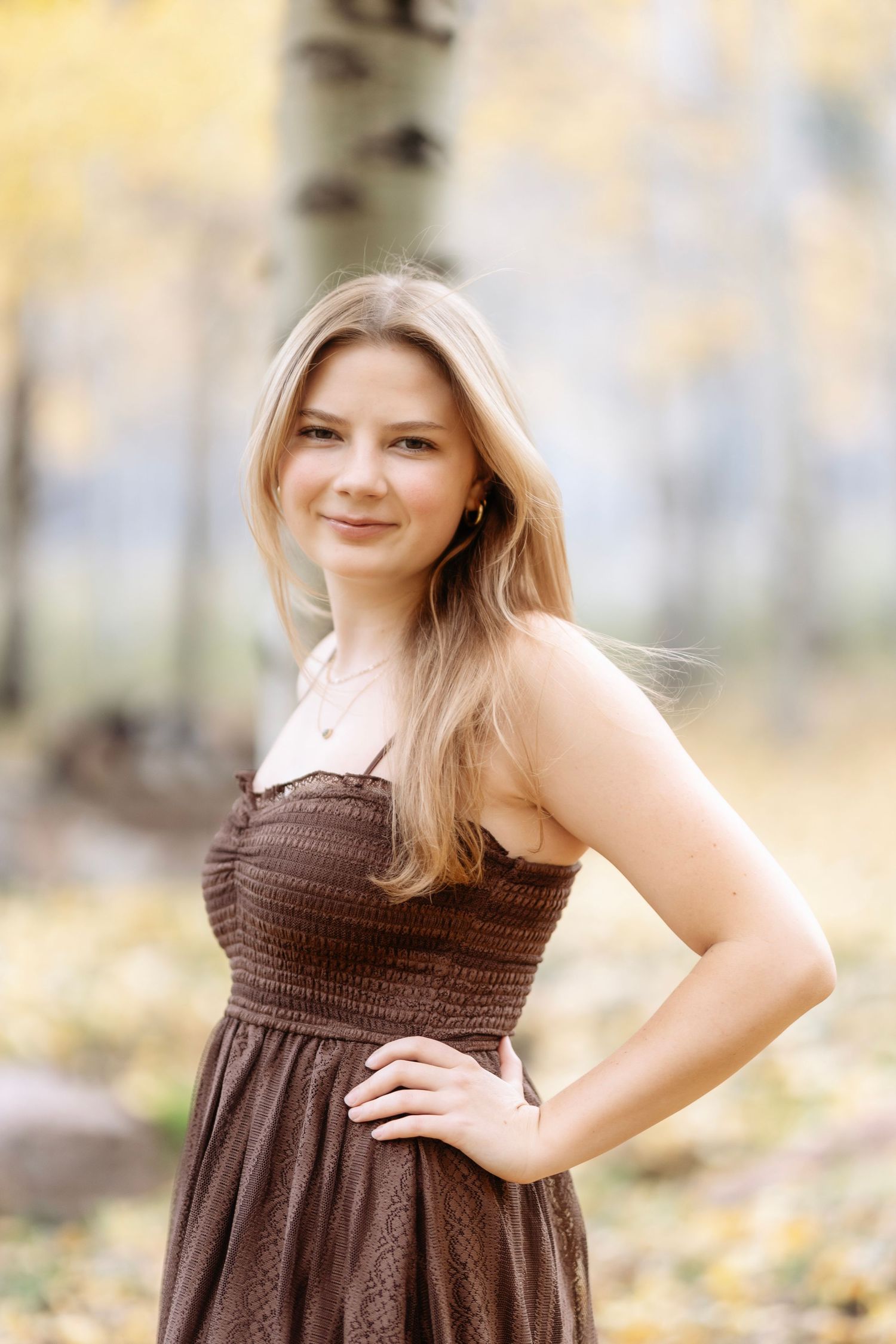 Senior girl laughing during Aspen senior photography in nature