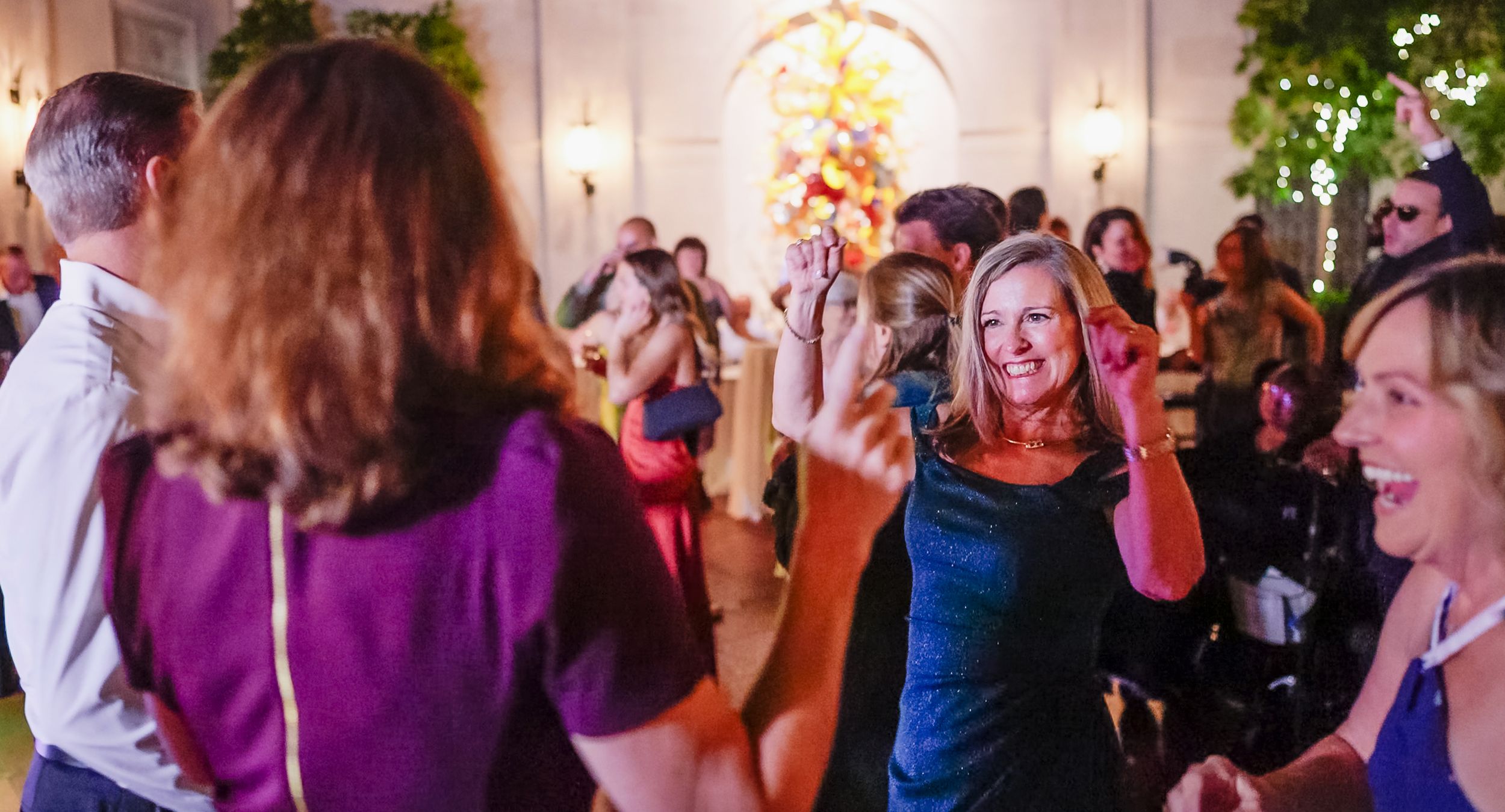 Wedding guests dance and celebrate on a lively dance floor at Columbus Museum Of Art