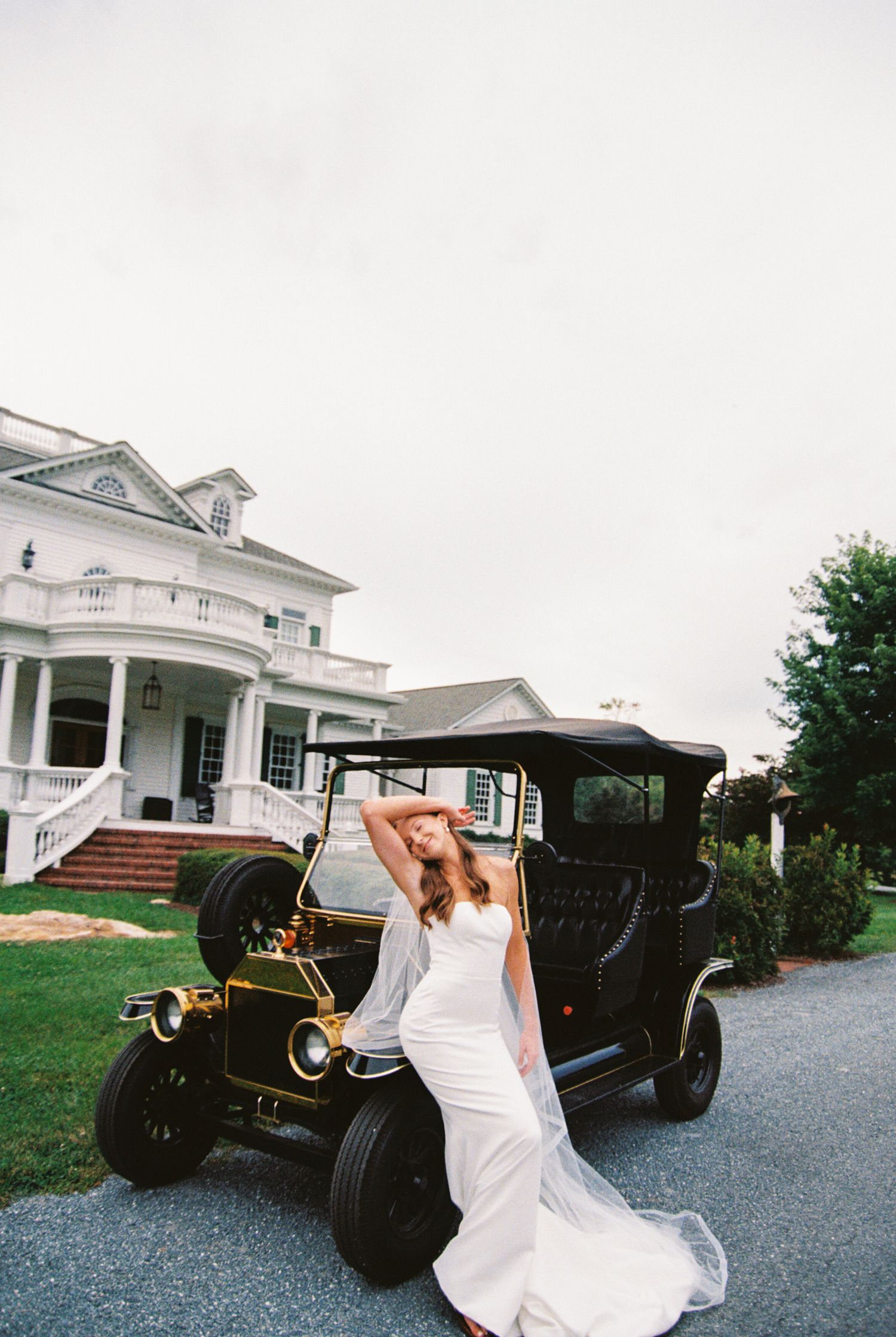 A series of photos showing a vintage black car parked on a gravel driveway next to a white house.