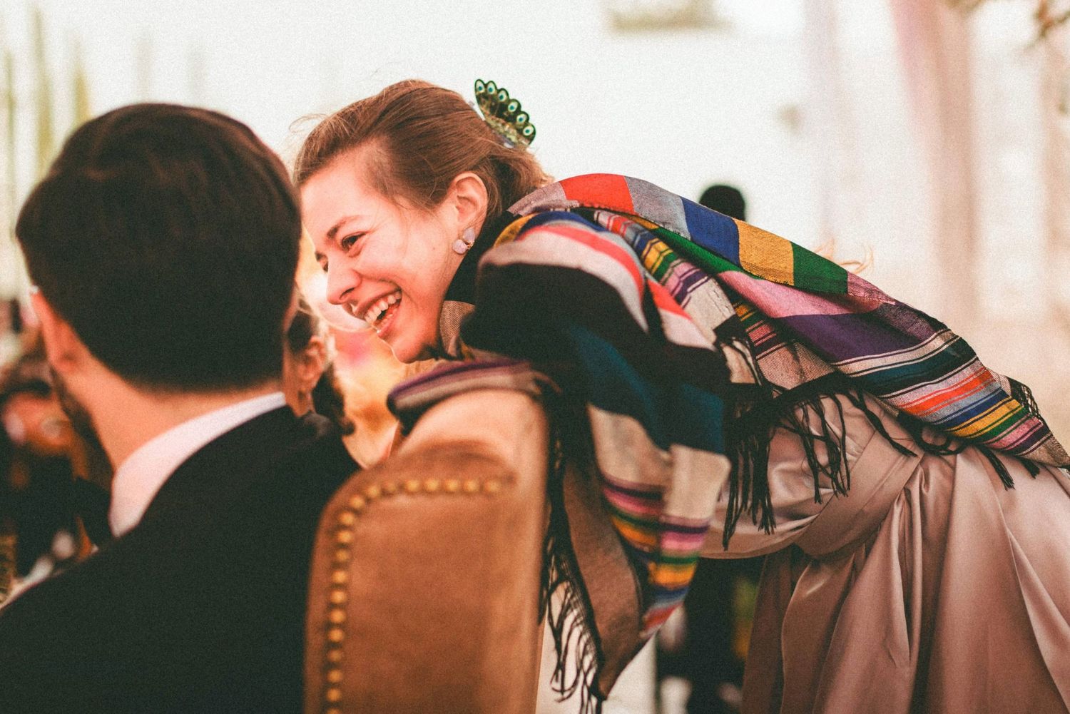 Wedding guests dancing and celebrating together on the dance floor during a reception celebration.