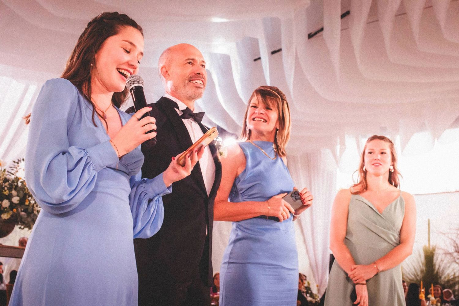 Couples dancing together in a bright indoor space during a social dance class or event.