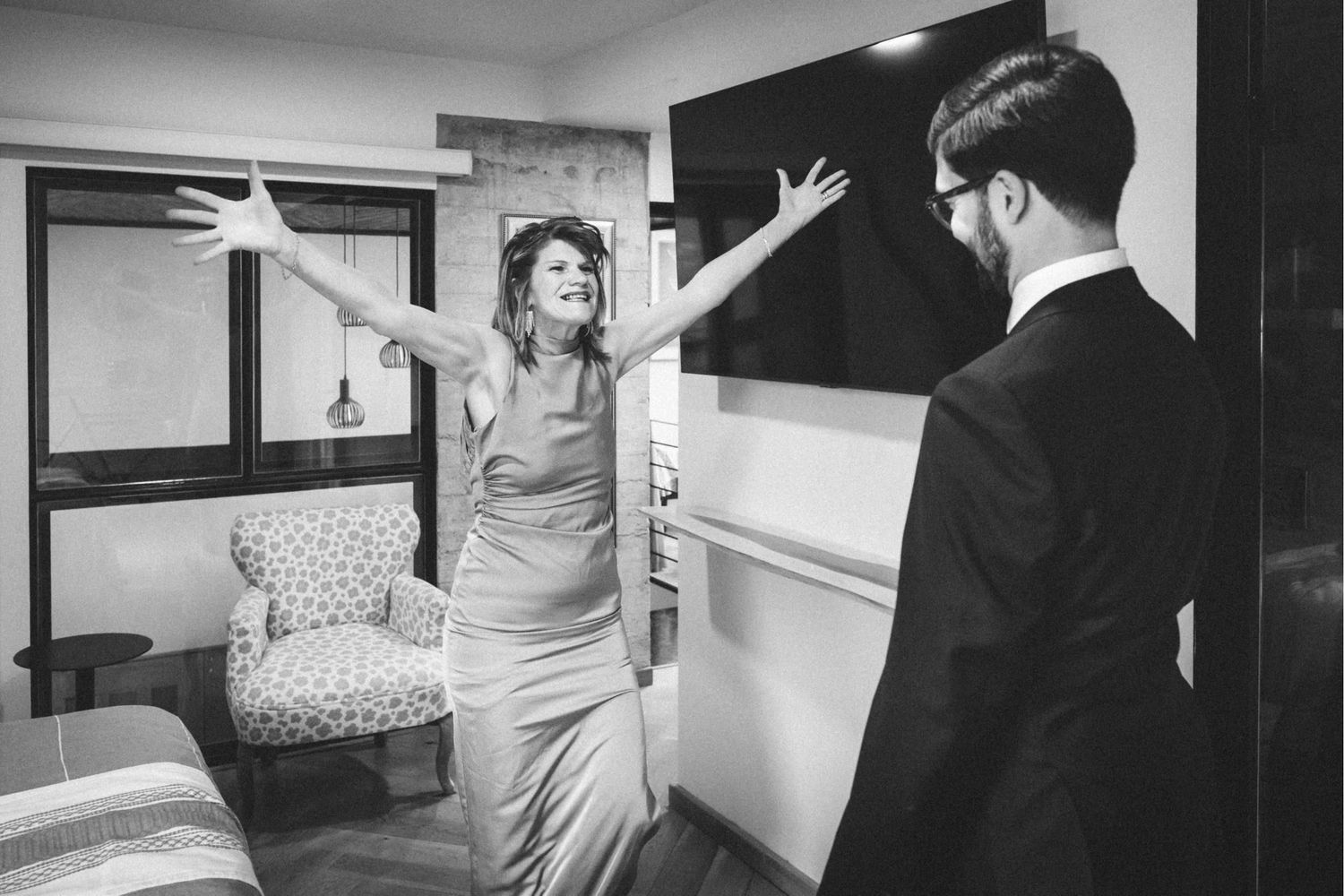 A series of black and white photos showing people dancing and posing in what appears to be an indoor event setting.
