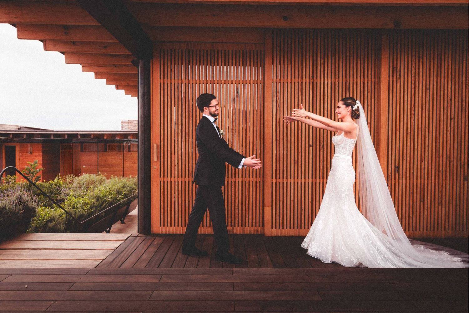 A romantic wedding photo series with a couple in formal attire against a wooden slatted wall backdrop.
