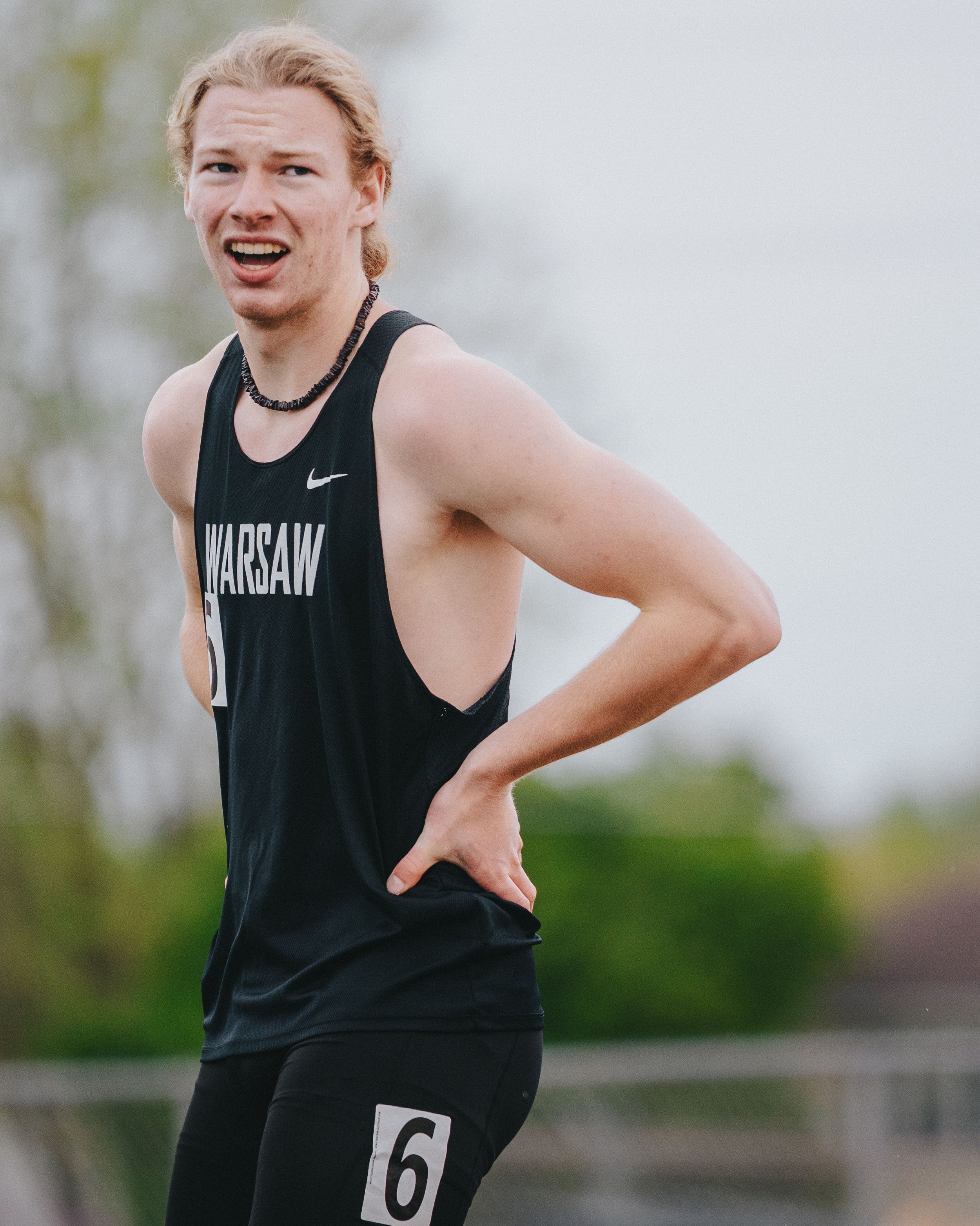 Dramatic Sports Photography of a track athlete following their 400m race - Warsaw, Indiana