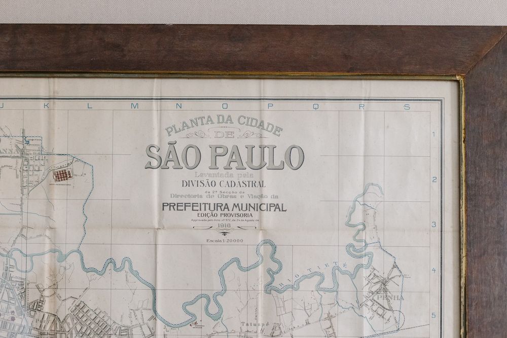 A vintage map of Sao Paulo framed on display.