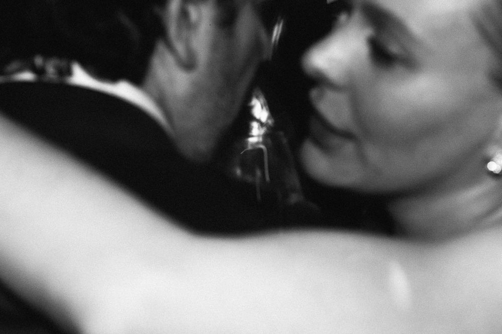 An intimate black and white photo captures a romantic dance moment.