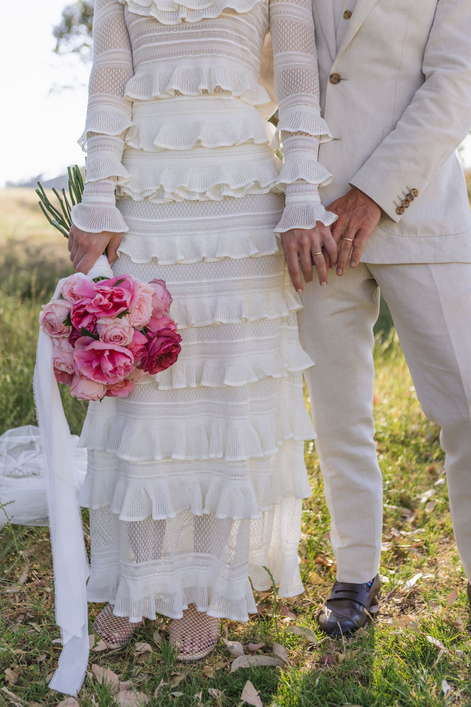 Bride and groom holding hands at Scone NSW Country wedding