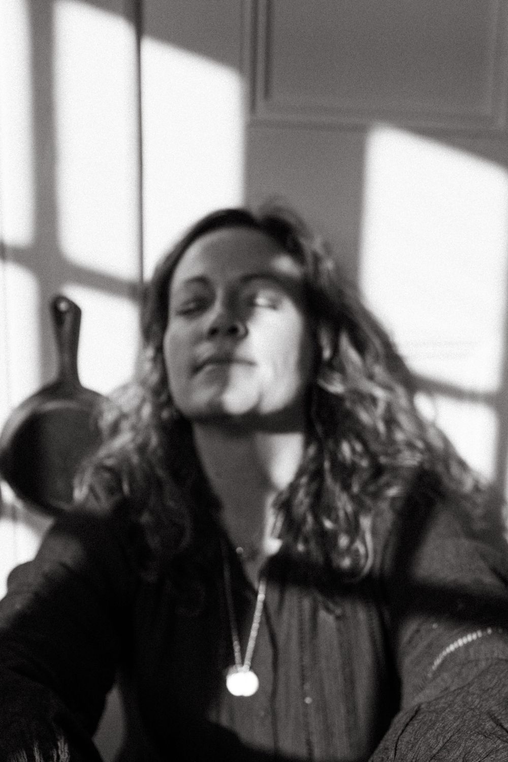 A series of black and white portraits showing movement and motion blur in an artistic style.
