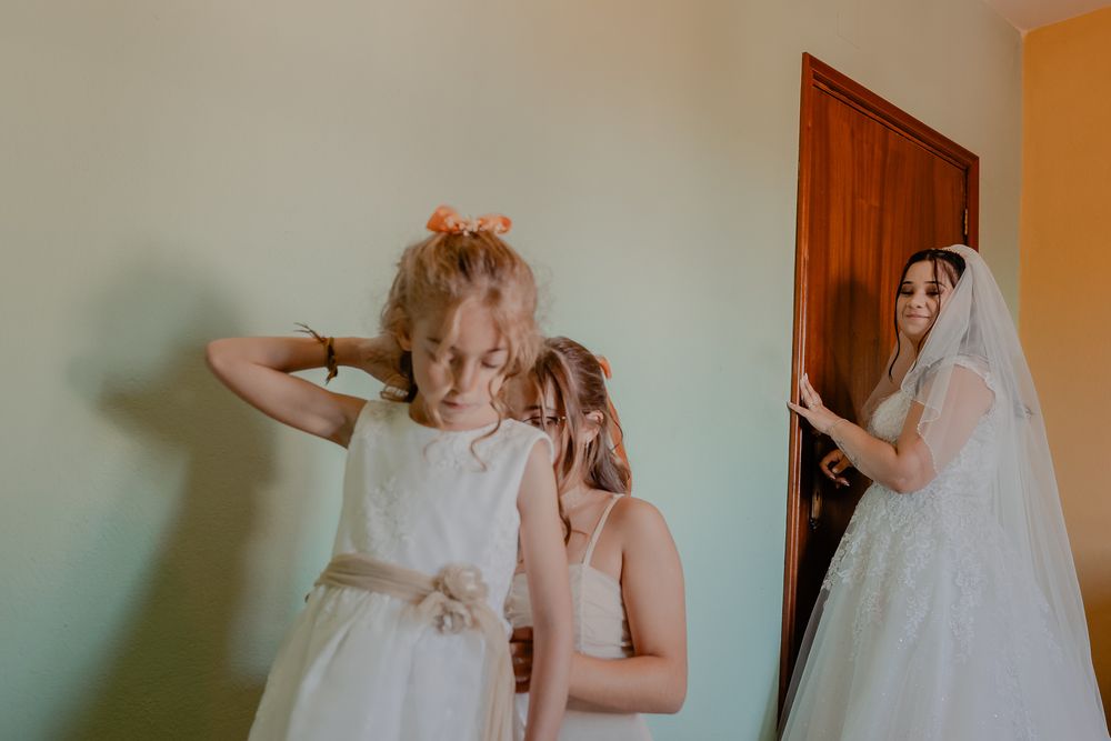Bride getting ready in a soft, natural light setting before the ceremony.