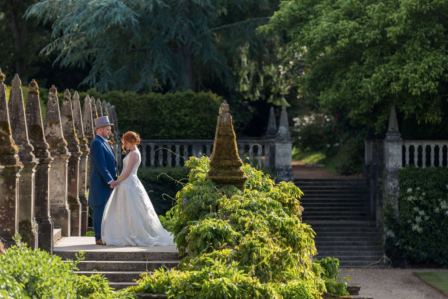 Tylney Hall wedding photography showing the bride and groom in the beautiful grounds
