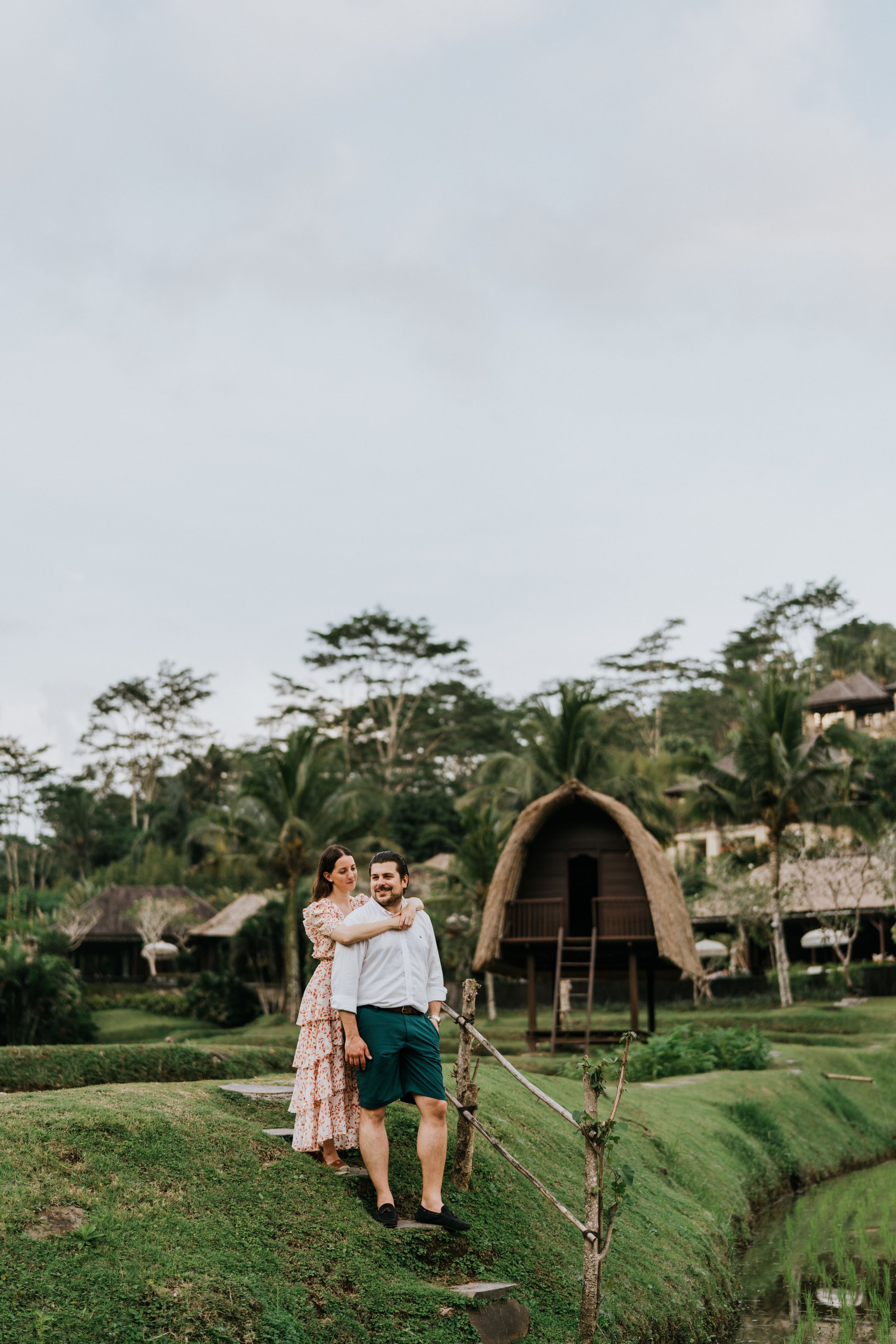 Romantic couple photoshoot services overlooking lush rice fields