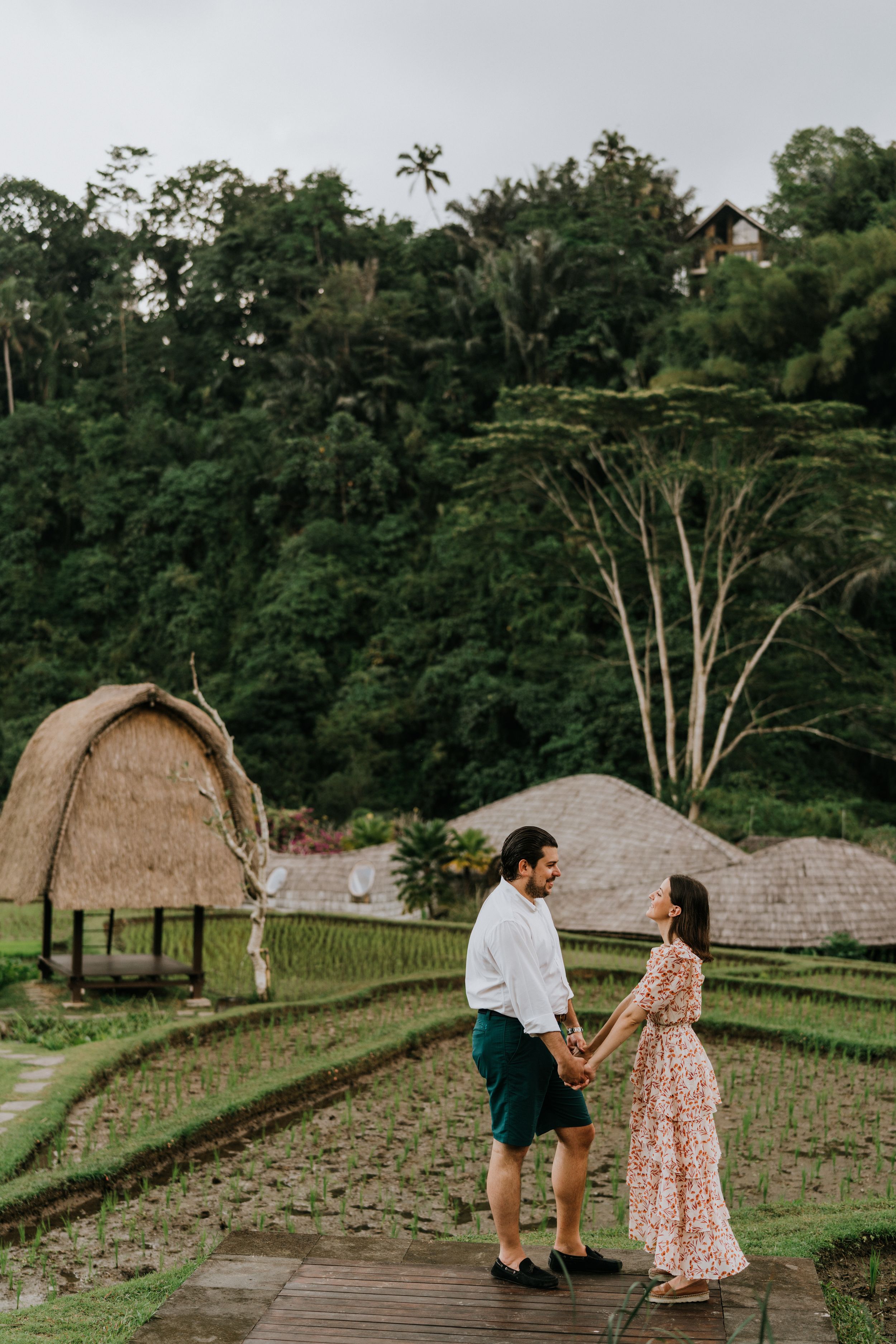 Romantic couple photoshoot services overlooking lush rice fields