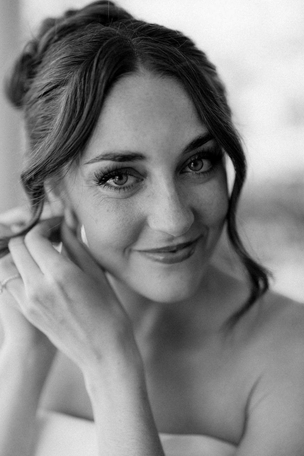 Bride putting on earrings while getting ready for her Costa Rica wedding in Guanacaste