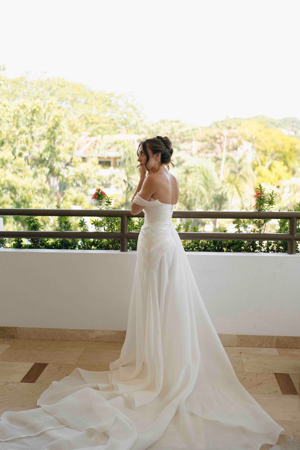 Bride enjoying a candid moment while preparing for her Costa Rica wedding at Westin Reserva Conchal.