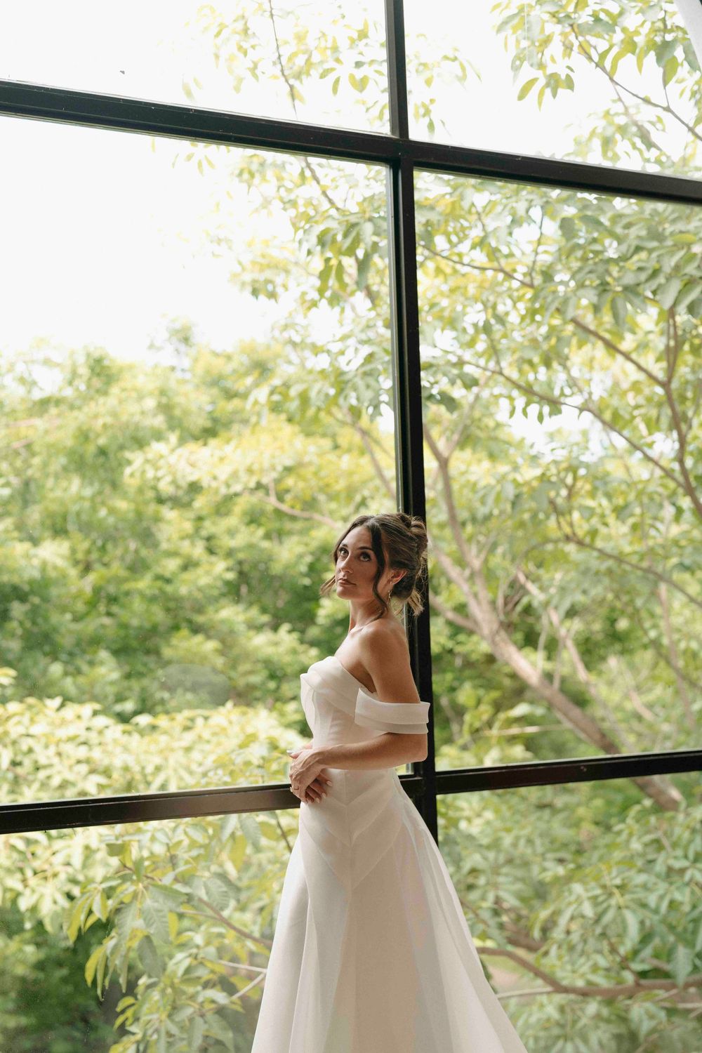 Bride standing gracefully in her wedding gown during a luxury beach wedding in Costa Rica.