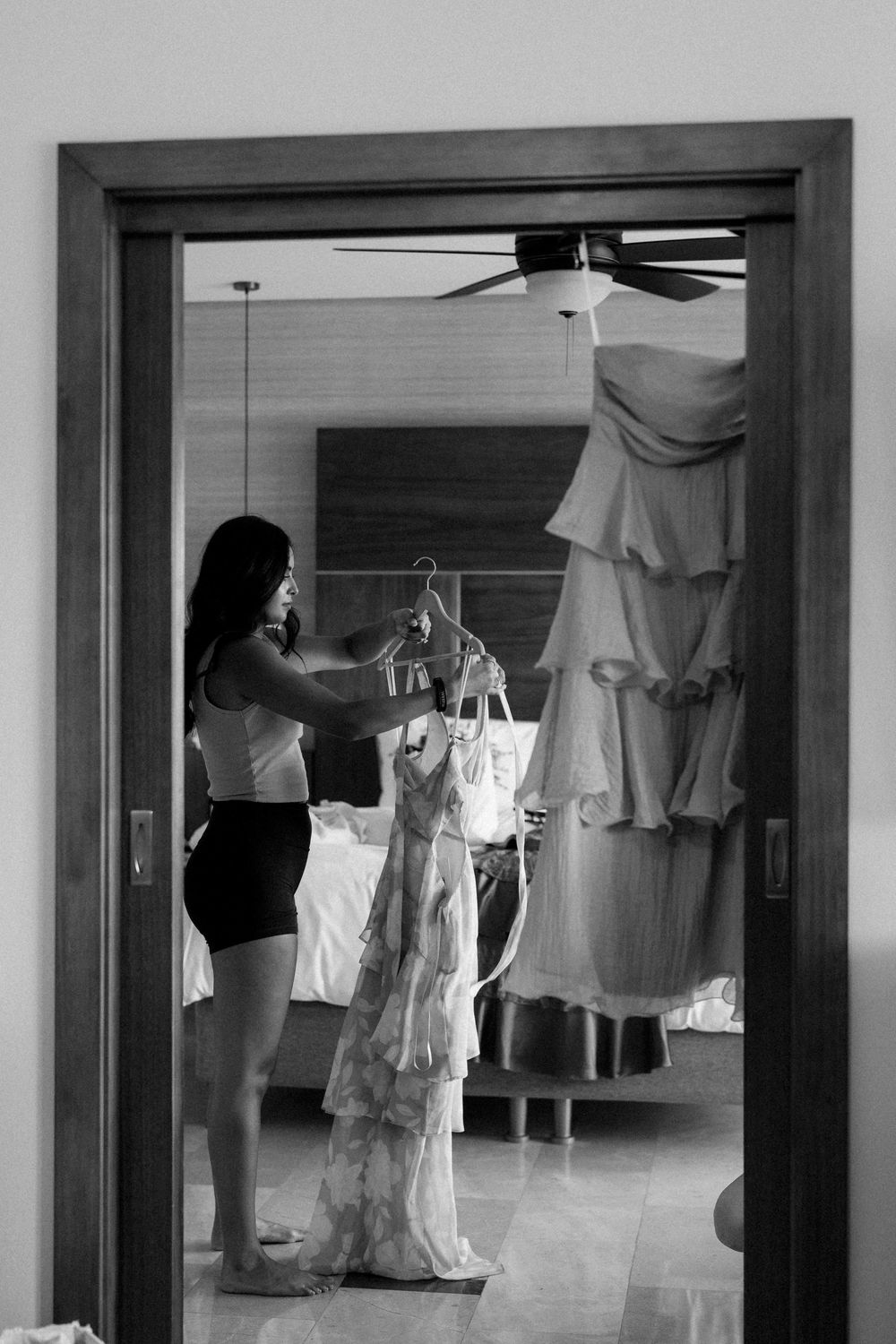 A friend of the bride getting ready in the room, before the celebration