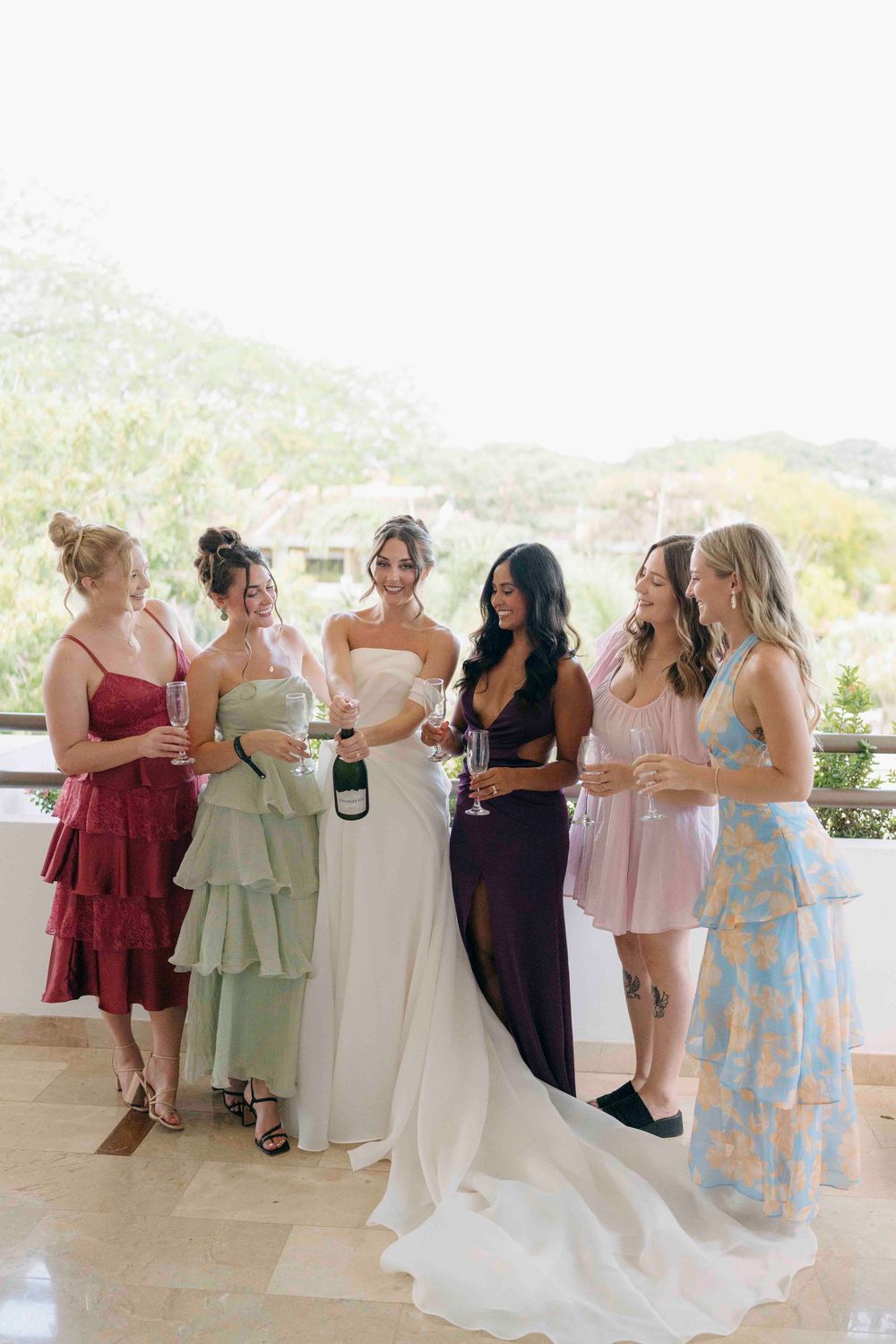 bride and friends making a toast before the ceremony in the westin reserva conchal in Guanacaste
