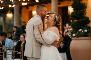 Couple sharing an intimate dance moment at their wedding reception.