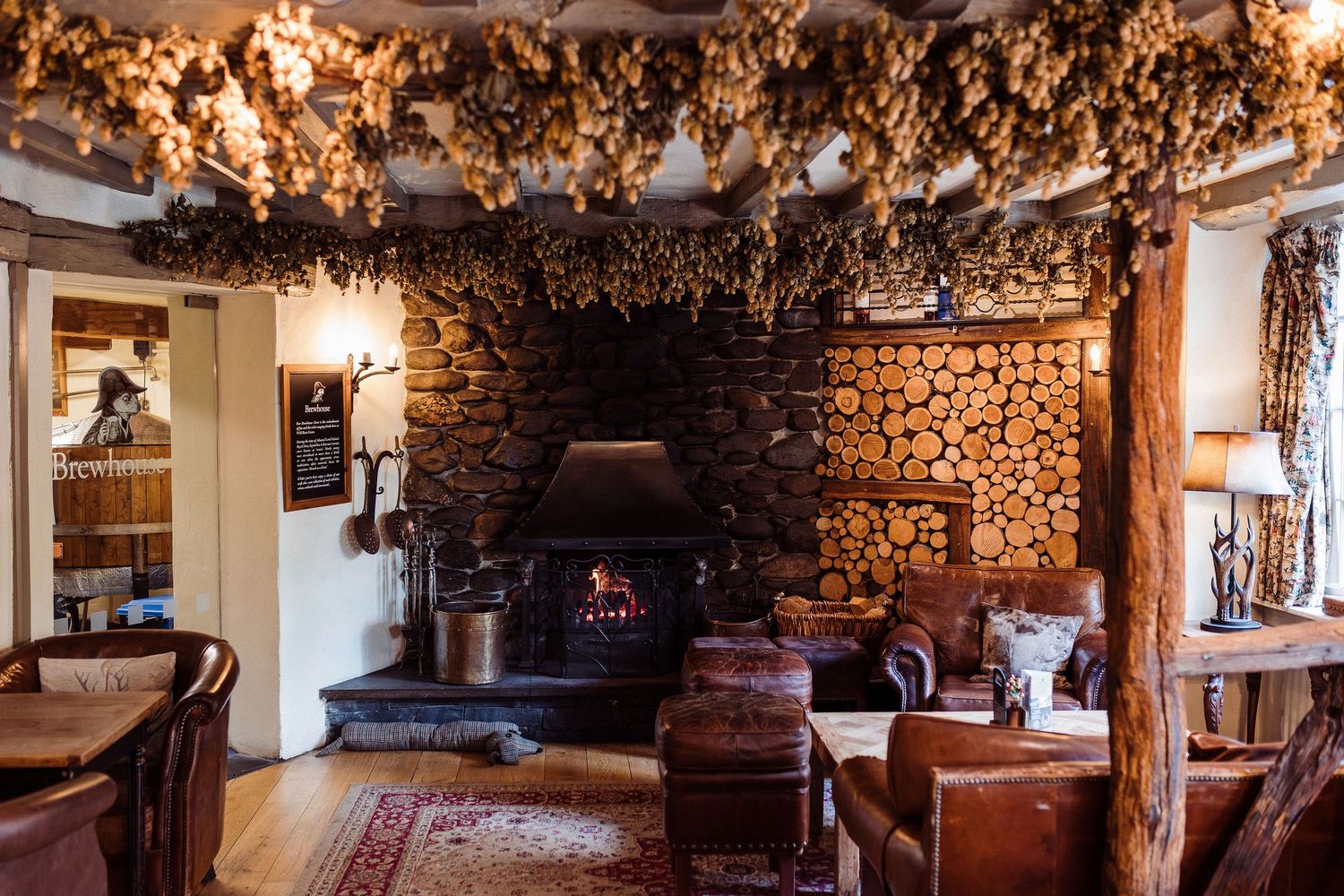 Rustic wine cellar interior with wooden barrels, stone walls, and warm lighting creating an intimate atmosphere.
