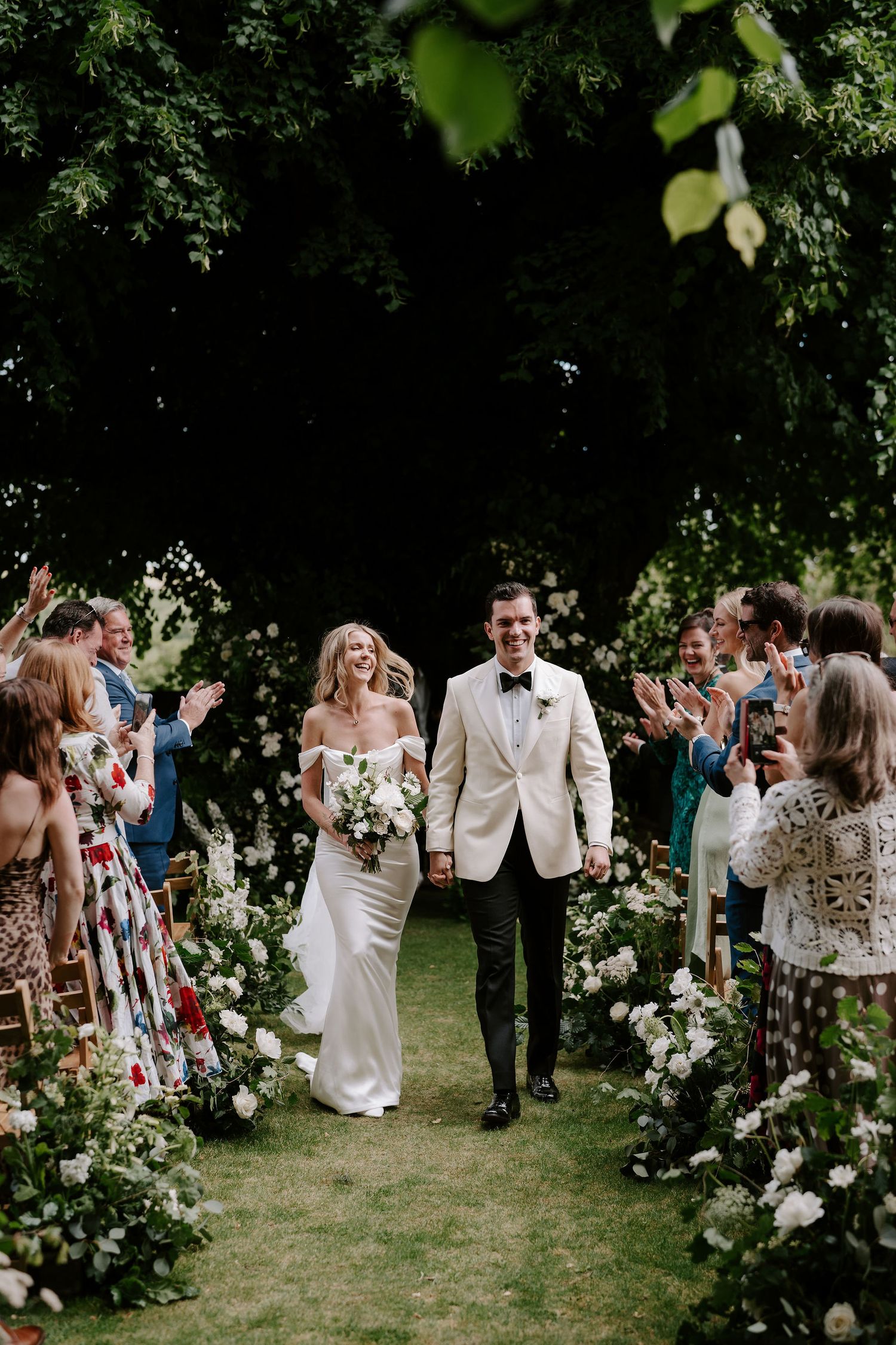 bride and groom cheering during ceremony at Hamswell house in bath