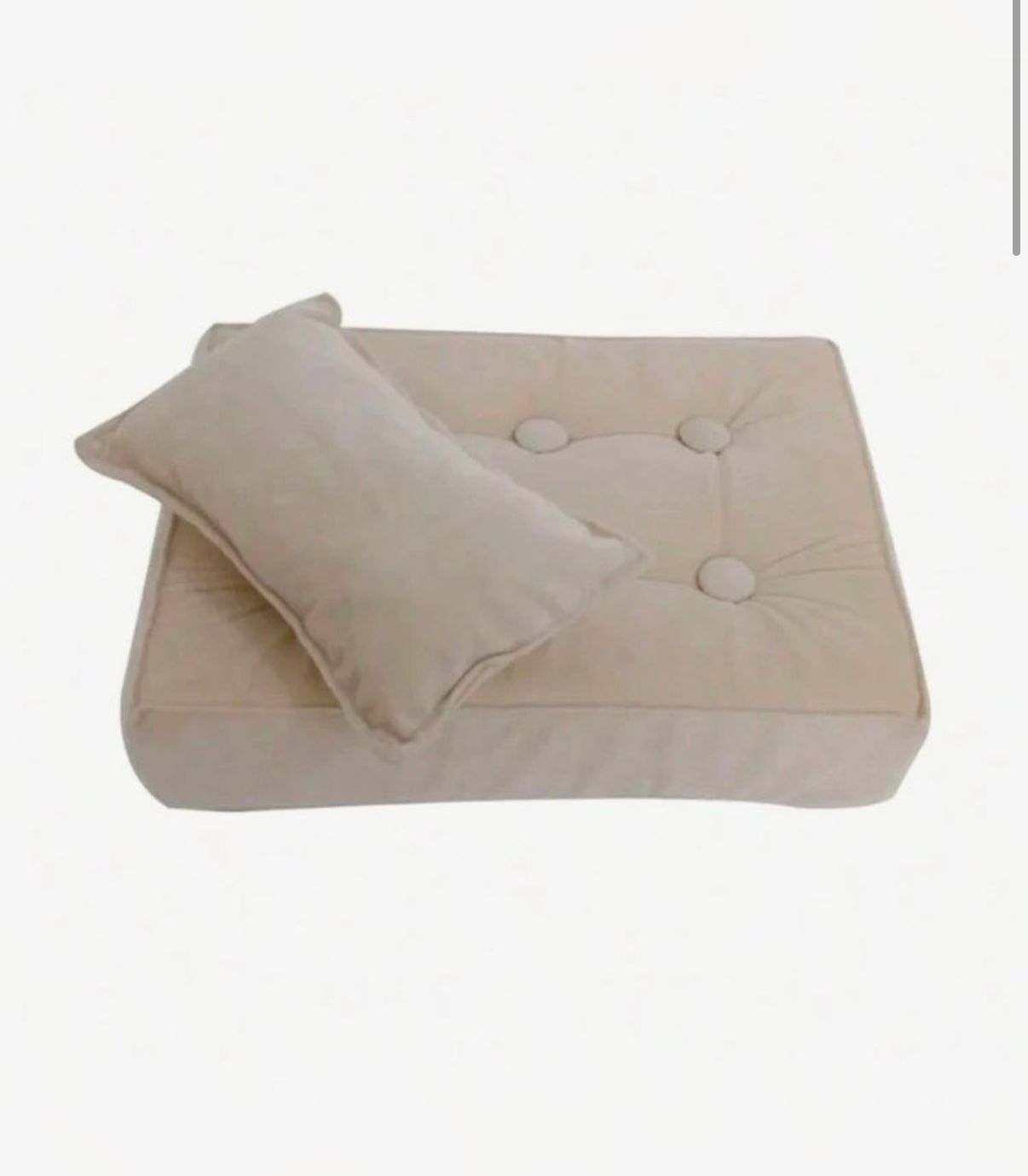 Cream colored cushion with button tufting shown from multiple angles.