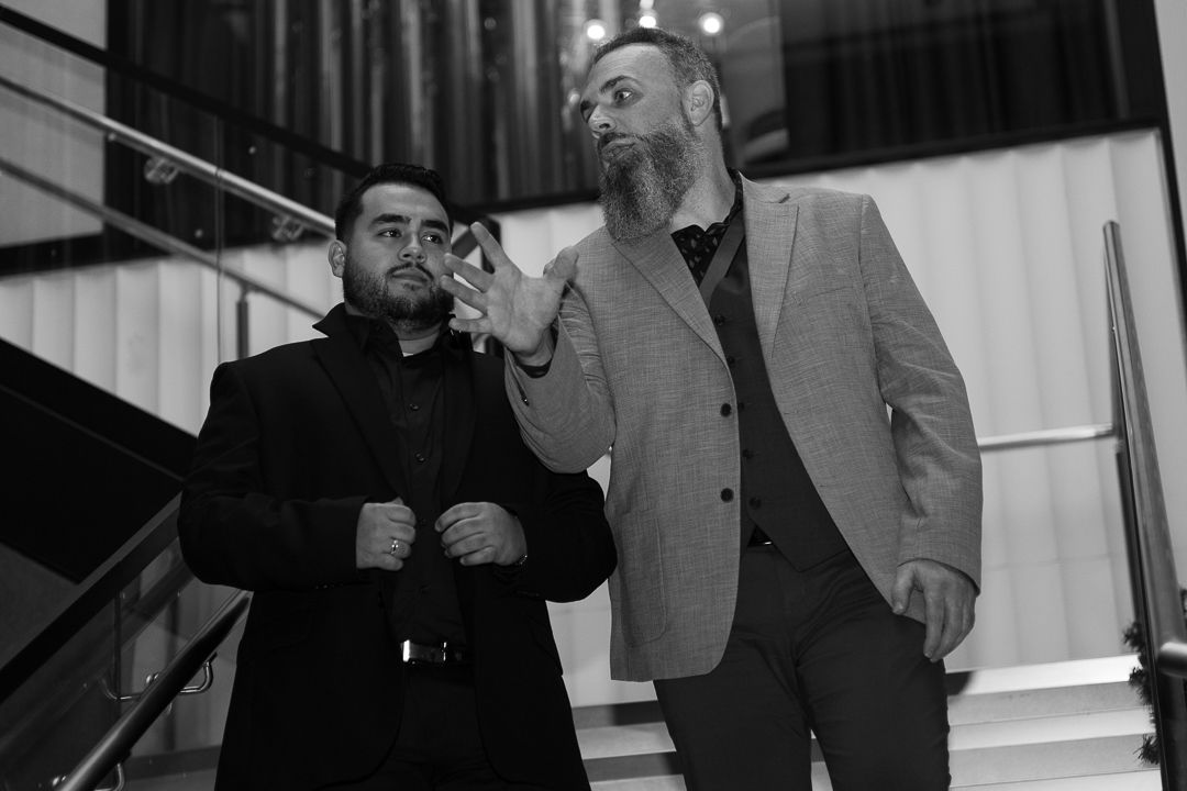 Candid black-and-white portrait photographed during a graduation celebration by Raymond C. Hansell Photography.