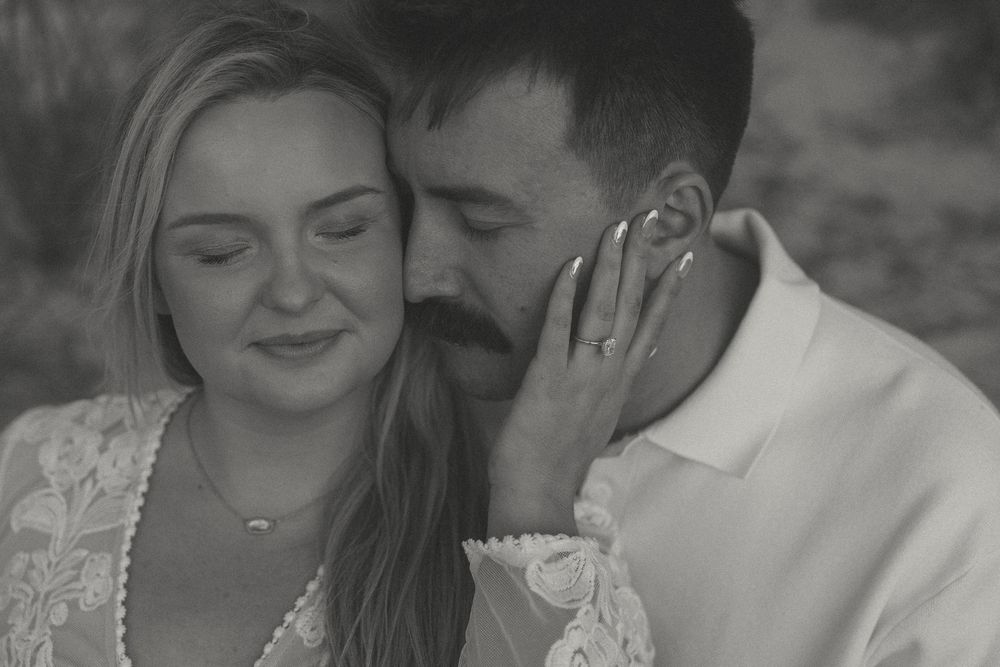 Moments after a Surprise Proposal in Wrightsville Beach, NC Romantic couples photo with engagement ring.