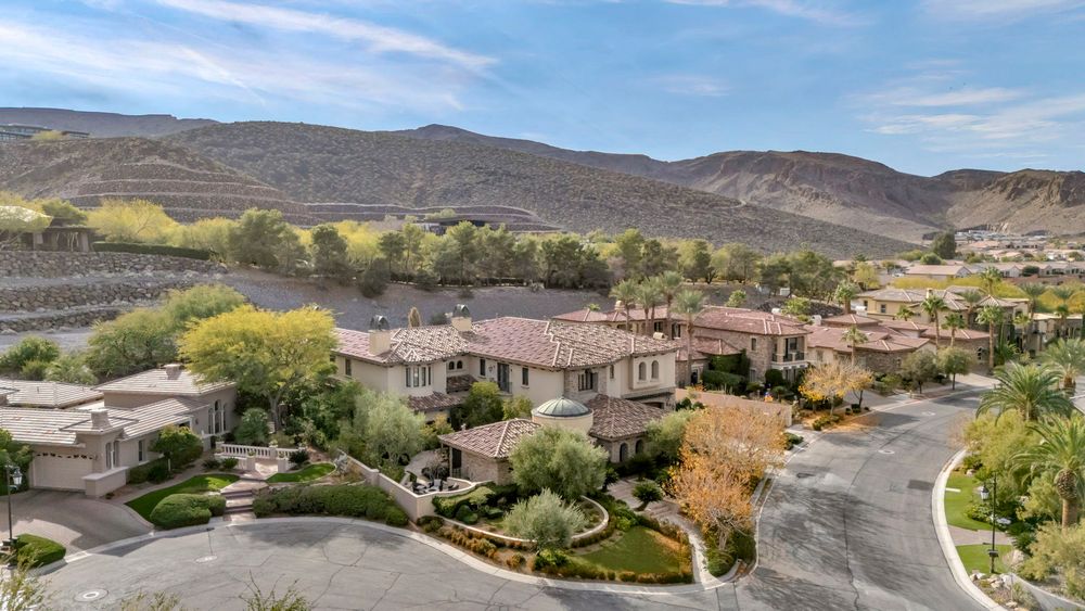 Luxury Mediterranean-style homes in a cul-de-sac with desert mountain views in Las Vegas, Nevada.