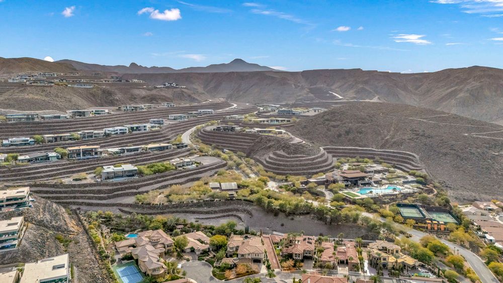 Aerial view of terraced luxury homes built into desert hillside near Las Vegas, Nevada.