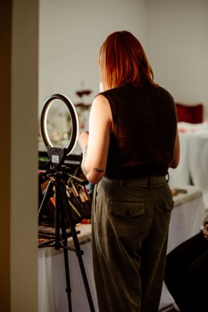 Behind the scenes wedding preparation with lighting equipment and mirrors.