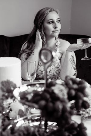 Black and white artistic wedding photography series with floral table decorations.
