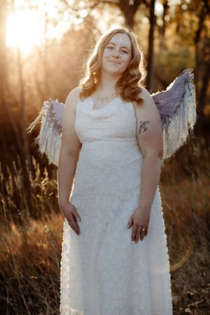 Ethereal outdoor portrait session in white dress at golden hour.