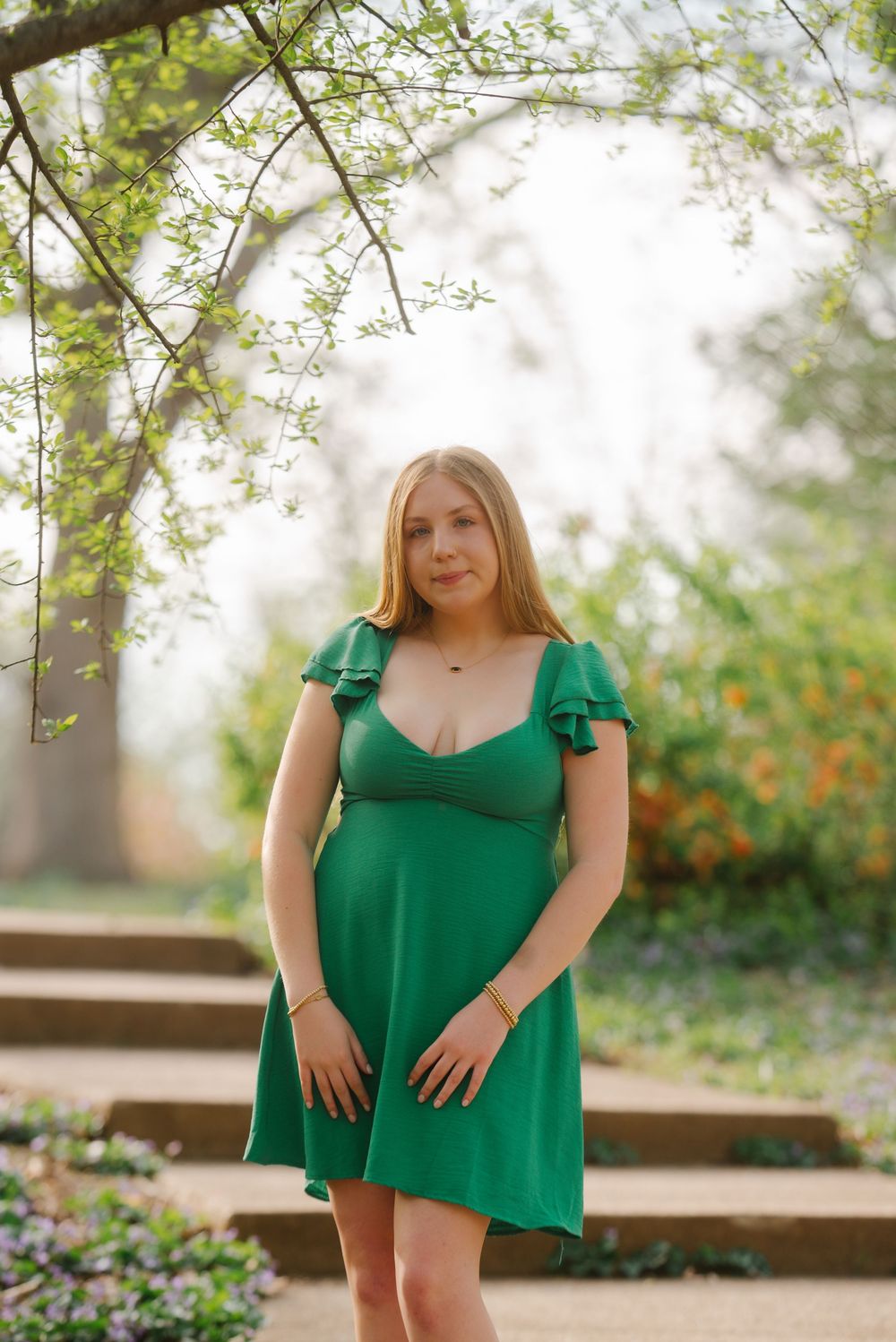 Series of outdoor portrait shots in a green top against a soft natural background with spring foliage.
