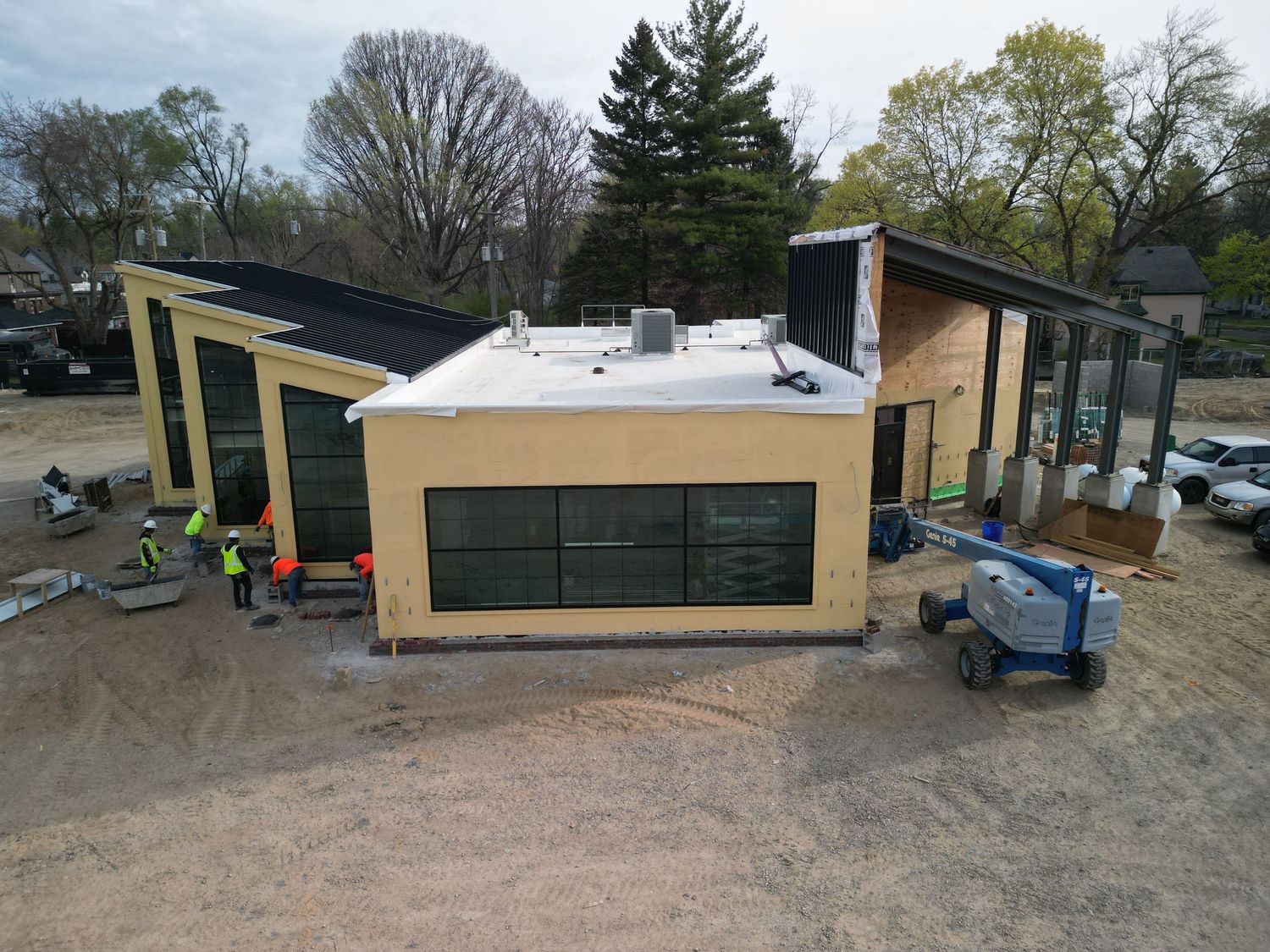 Drone photo of completed commercial building at construction site, showing final build quality by Aerial Detroit.