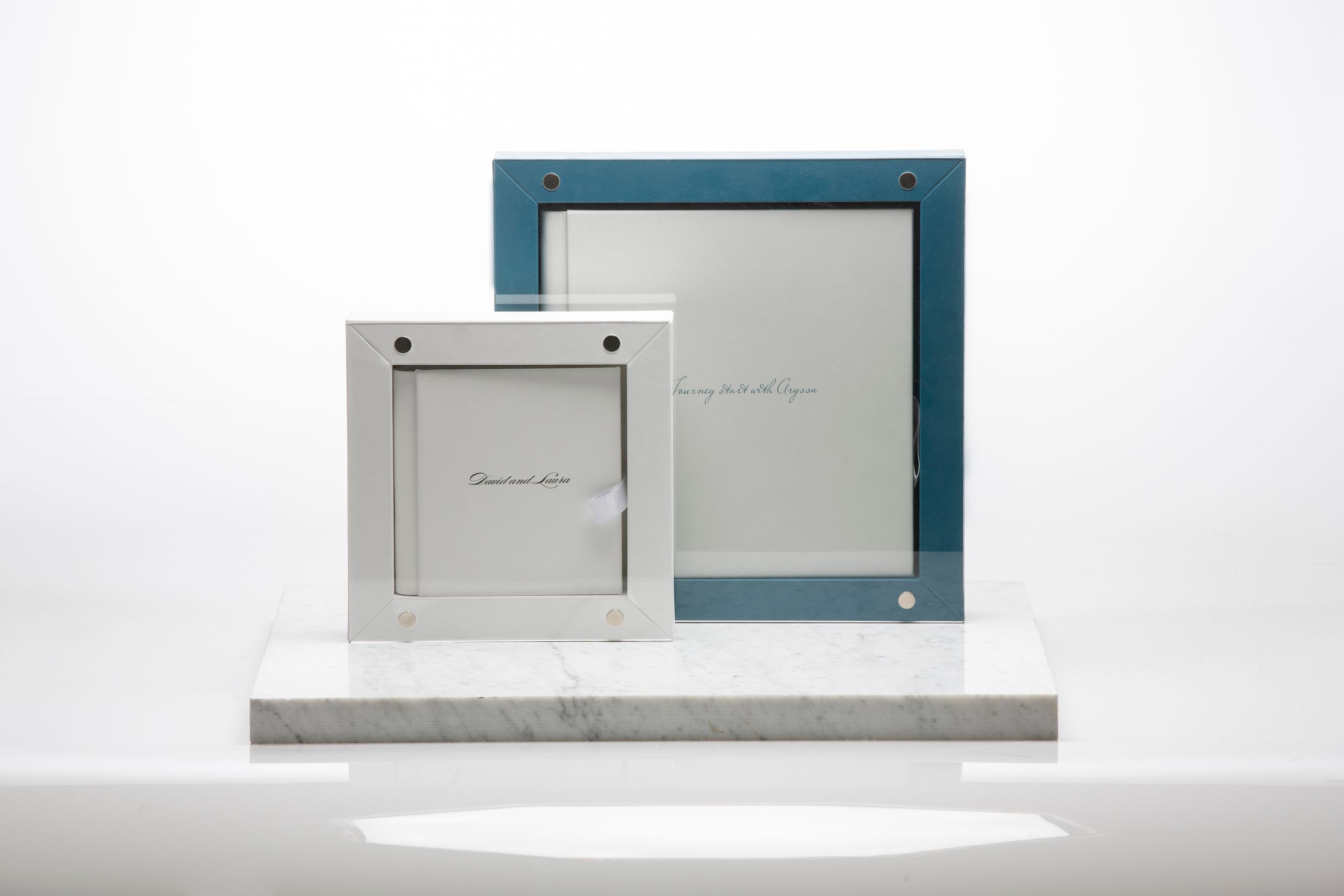 Modern white and turquoise architectural frames arranged in a minimalist composition against white background.