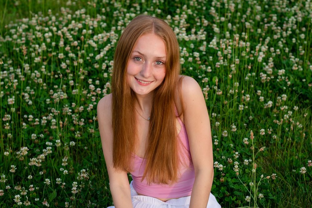 Natural senior photos in a garden. Senior photos with wildflowers. Portraits in a field of flowers.Senior photos in a flower field Lafayette