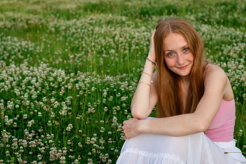 Natural senior photos in a garden. Senior photos with wildflowers. Portraits in a field of flowers. Senior photos in a flower field