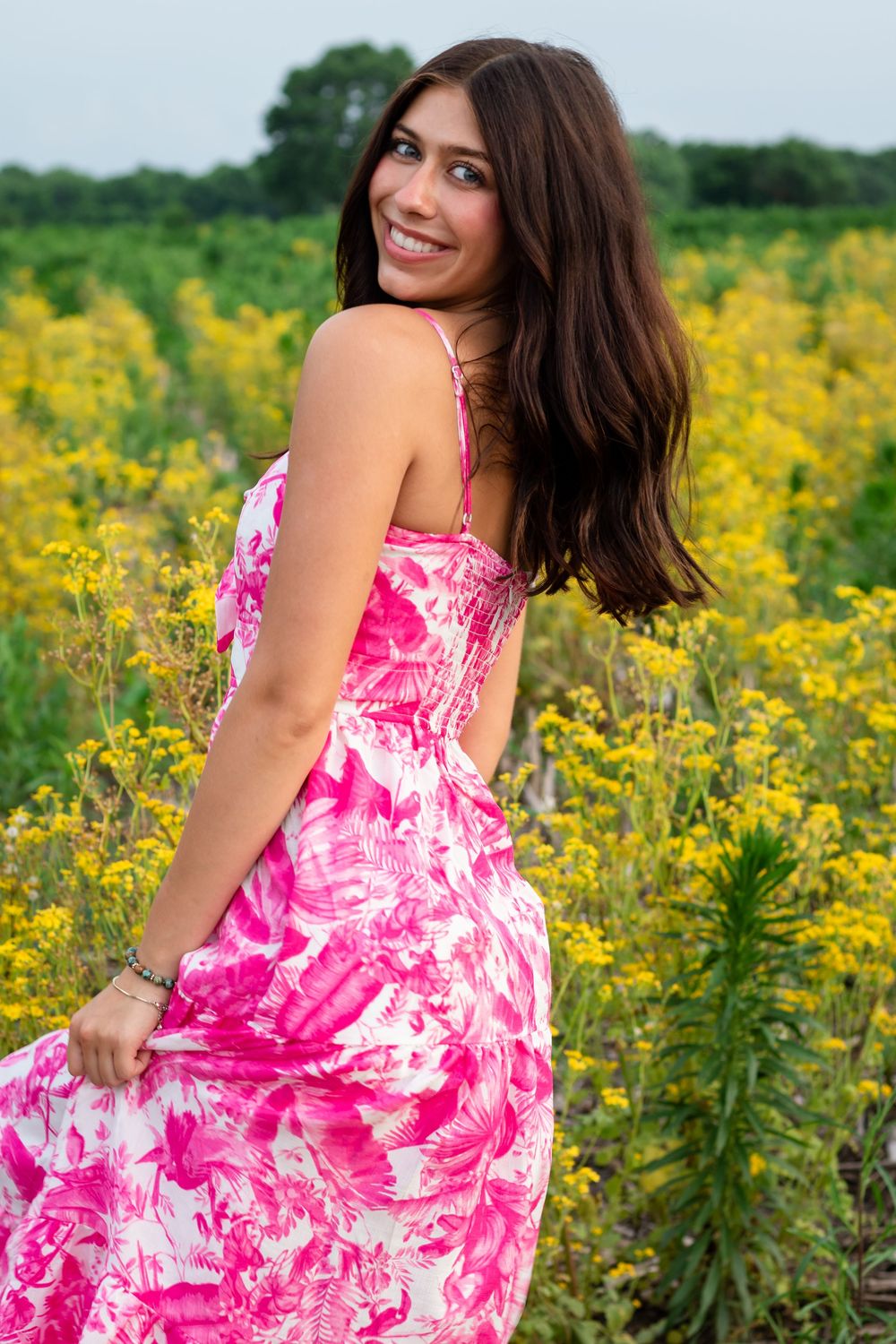 Natural senior photos in a garden. Senior photos with wildflowers. Portraits in a field of flowers. Senior photos in a flower field