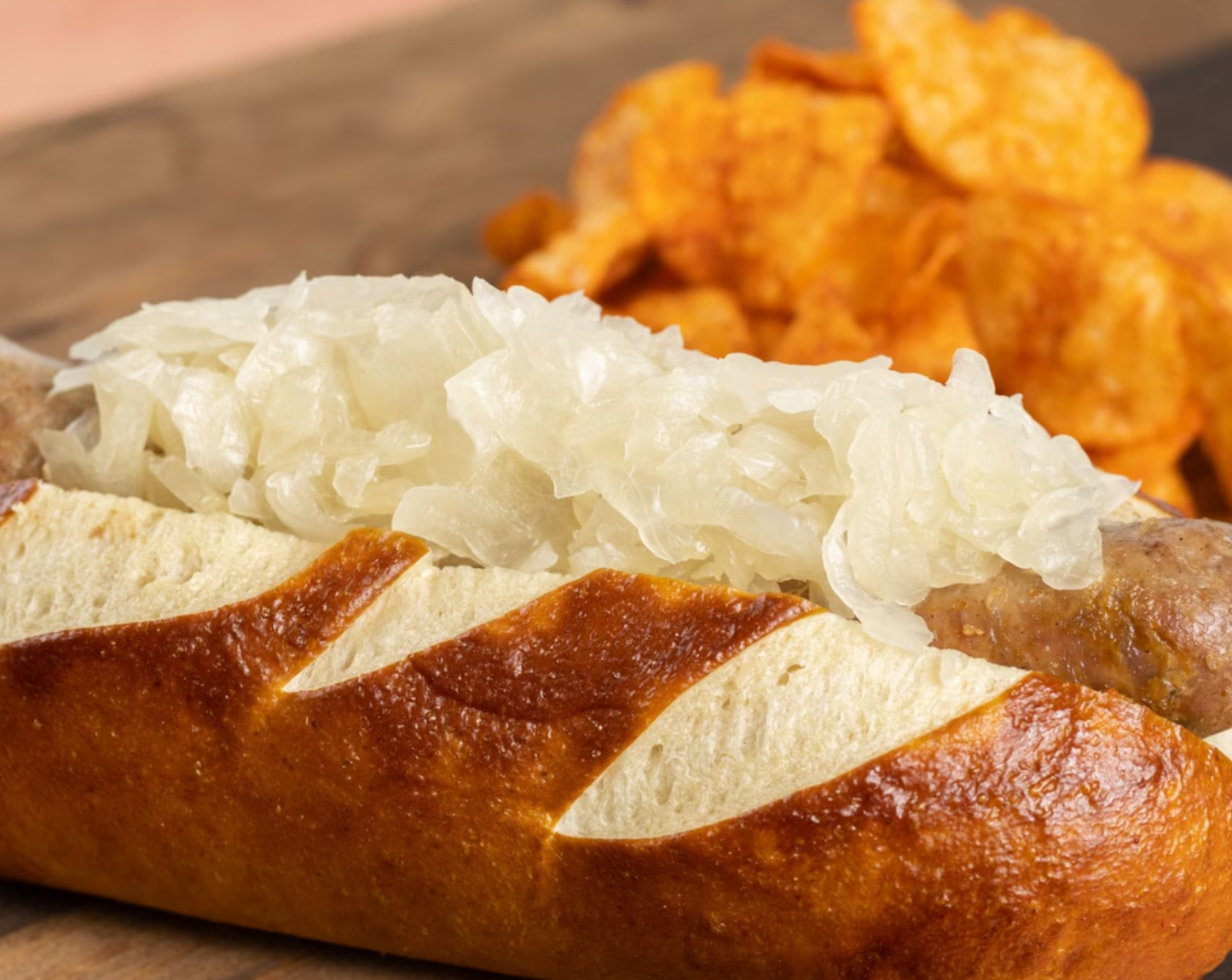Freshly baked pretzel bread topped with sauerkraut served with potato chips.