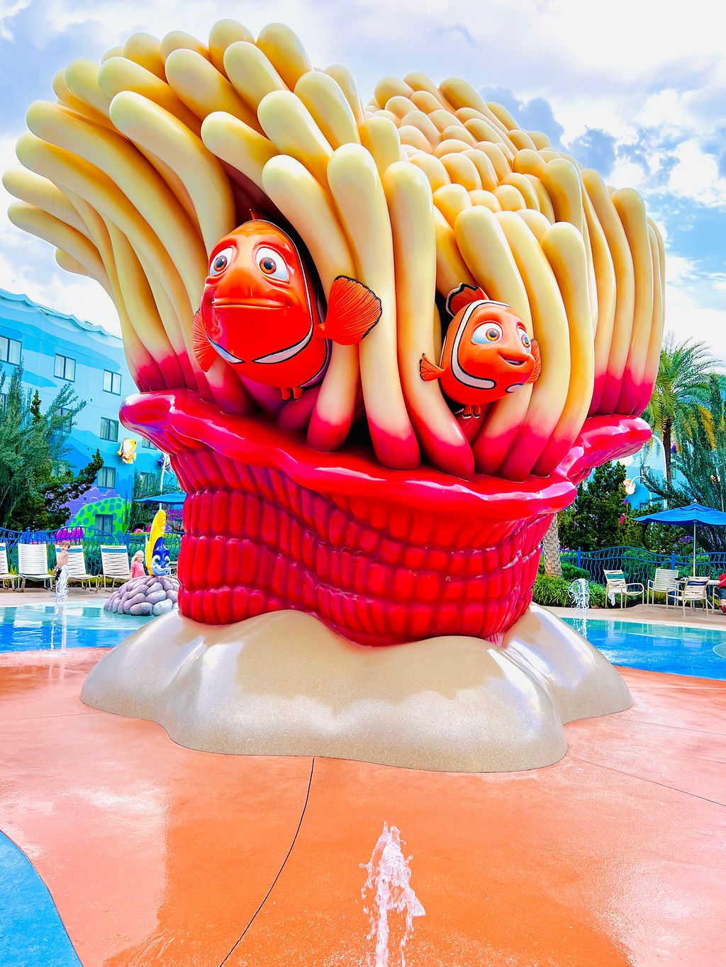 Finding Nemo themed sculpture with red clownfish characters nestled in cream-colored anemone.